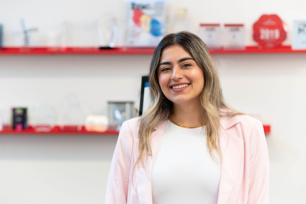 Woman smiling at the camera.