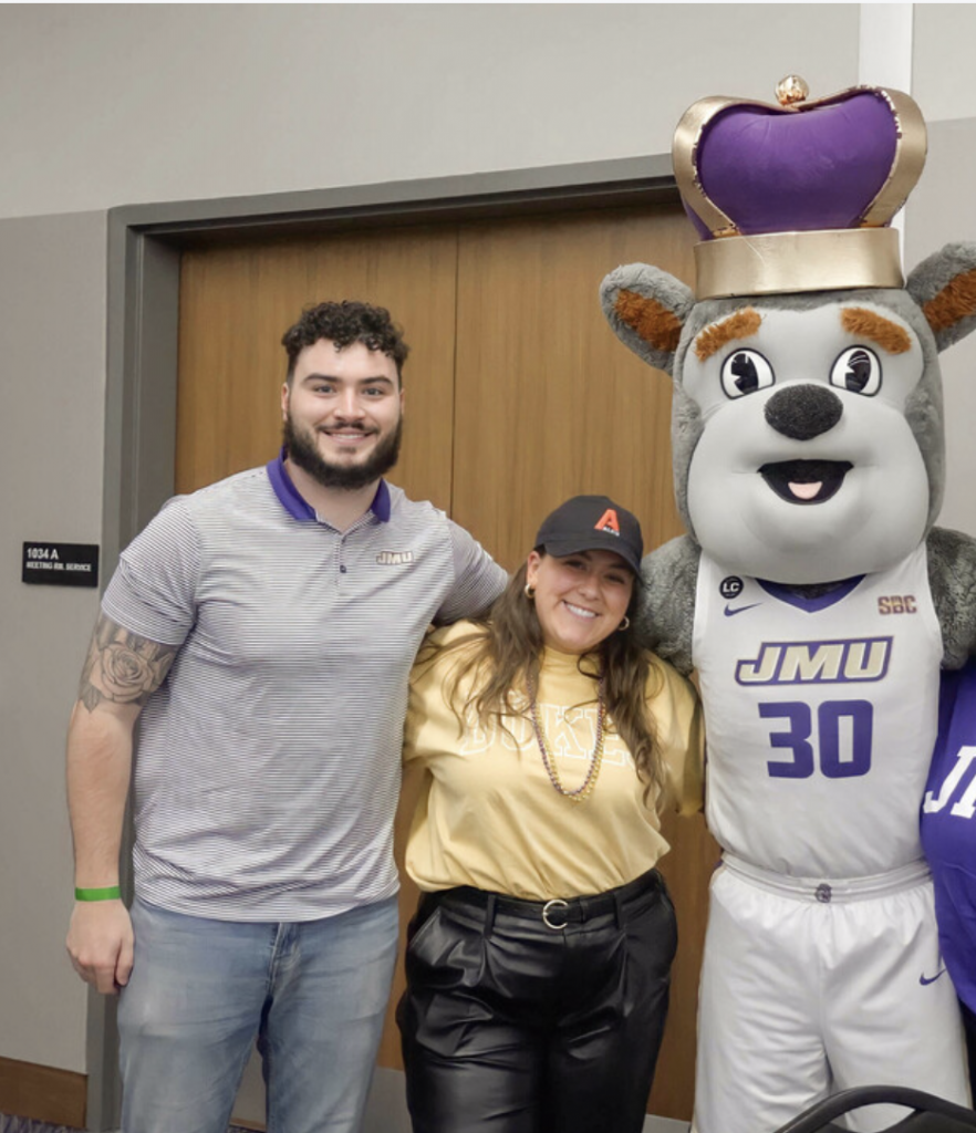 Three people smiling at the camera.