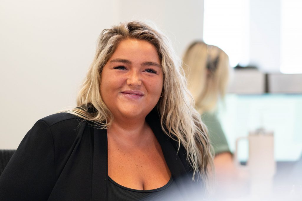 Woman smiling at the camera.